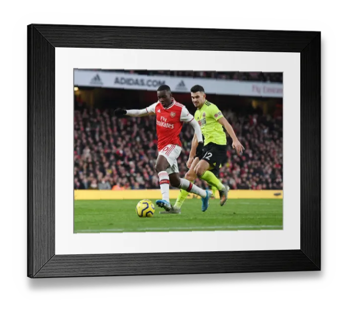 Framed Print : Arsenal's Eddie Nketiah Clashes with Sheffield United's John Egan in Premier League Showdown
