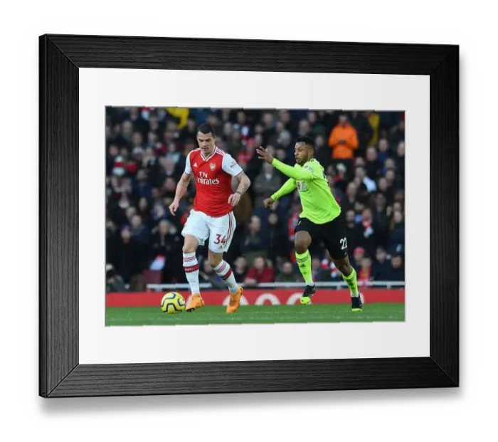 Framed Print : Arsenal's Xhaka Faces Pressure from Sheffield United's Mousset in Premier League Clash