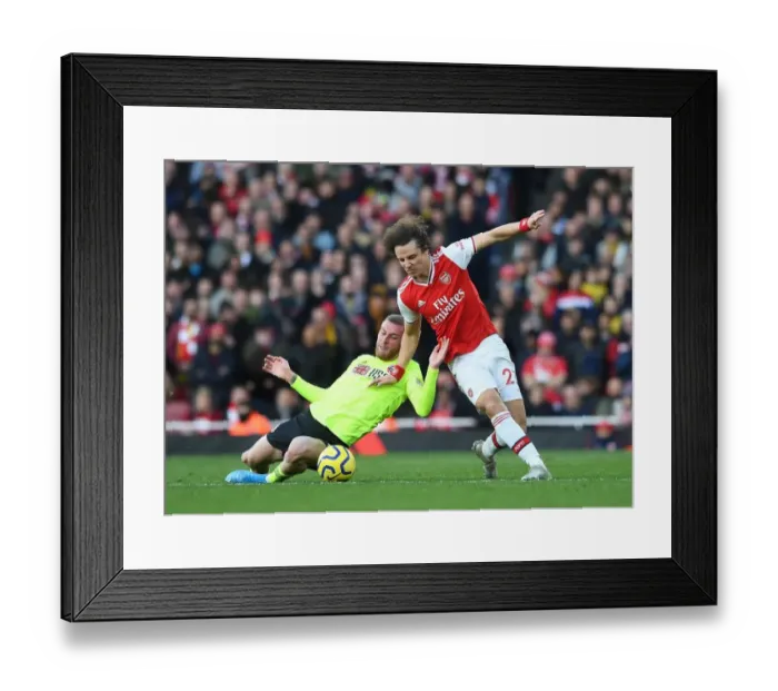 Framed Print : David Luiz vs Oli McBurnie: A Battle of Willpower at the Emirates