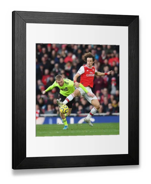 Framed Print : Arsenal vs Sheffield United: A Battle Between David Luiz and Oli McBurnie at the Emirates Stadium