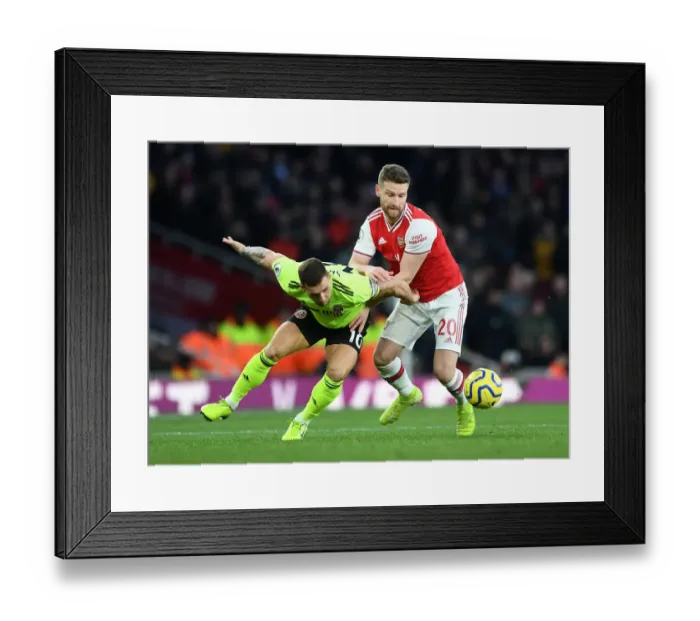 Framed Print : Mustafi vs. Sharp: A Tense Battle at the Emirates Framed Print : Mustafi vs. Sharp: A Tense Battle at the Emirates