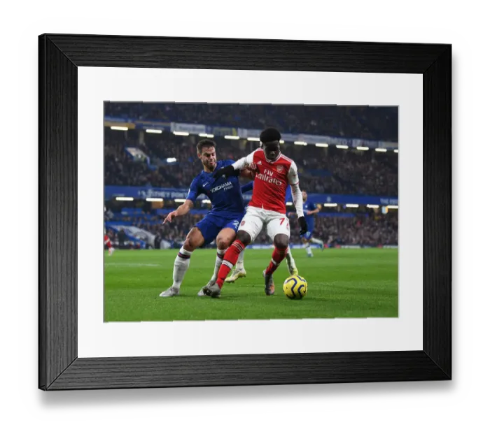 Framed Print : Clash of Skills: Saka vs Azpilicueta - A Premier League Showdown at Stamford Bridge Framed Print : Clash of Skills: Saka vs Azpilicueta - A Premier League Showdown at Stamford Bridge