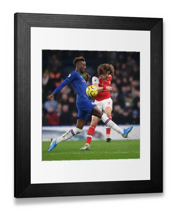 Framed Print : David Luiz Fends Off Abraham: Intense Moment from Chelsea vs. Arsenal Premier League Clash (2019-20)
