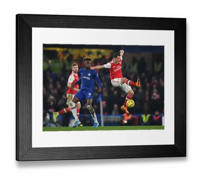 Framed Print : Xhaka vs Abraham: Intense Clash Between Chelsea and Arsenal in Premier League