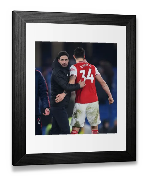 Framed Print : Arsenal's Victory at Stamford Bridge: Mikel Arteta Celebrates with Granit Xhaka