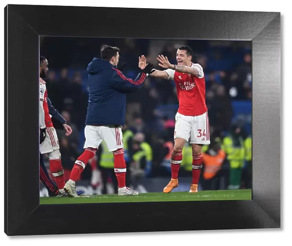 Celebrating Victory: Xhaka and Ozil Reunite in Arsenal's Chelsea Win (2019-20)