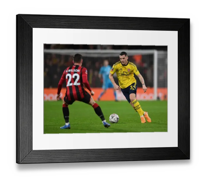 Framed Print : Granit Xhaka's Midfield Masterclass: Arsenal Advances in FA Cup with Win Against AFC Bournemouth