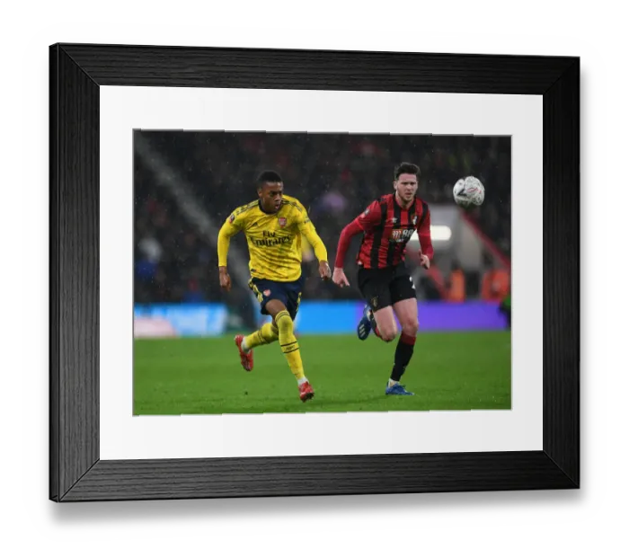 Framed Print : Arsenal's Joe Willock Clashes with Bournemouth's Jack Simpson in FA Cup Fourth Round
