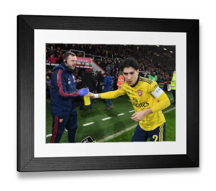Framed Print : Arsenal's Hector Bellerin Shares Water with Physio Amid FA Cup Battle Against AFC Bournemouth