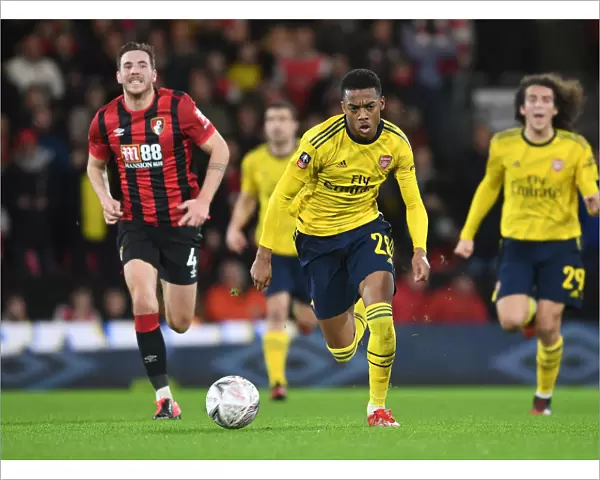 Arsenal's Joe Willock Breaks Past Bournemouth's Dan Gosling in FA Cup Fourth Round Clash