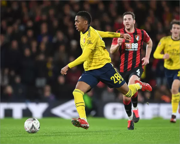 Arsenal's Joe Willock Outmaneuvers Bournemouth's Dan Gosling in FA Cup Clash