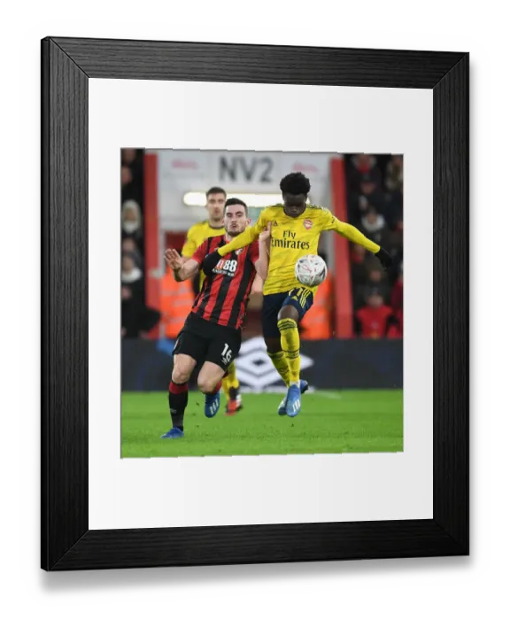 Framed Print : Arsenal's Bukayo Saka Outwits Lewis Cook: FA Cup Victory Moment