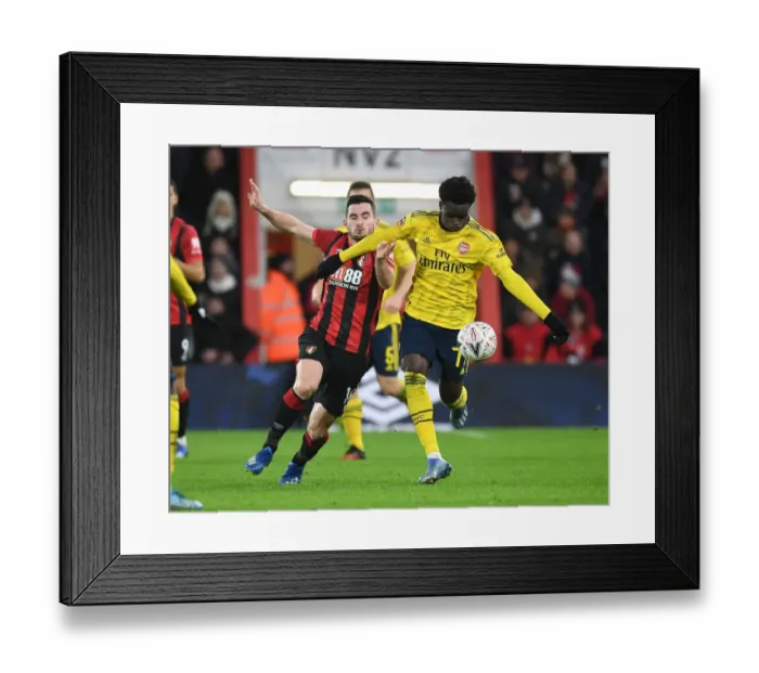 Framed Print : Arsenal's Bukayo Saka Dazzles Lewis Cook: FA Cup Victory Moment Framed Print : Arsenal's Bukayo Saka Dazzles Lewis Cook: FA Cup Victory Moment