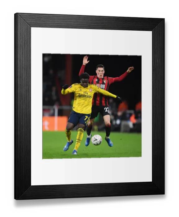 Framed Print : Arsenal's Bukayo Saka Outsmarts Harry Wilson: FA Cup Victory Moment Framed Print : Arsenal's Bukayo Saka Outsmarts Harry Wilson: FA Cup Victory Moment