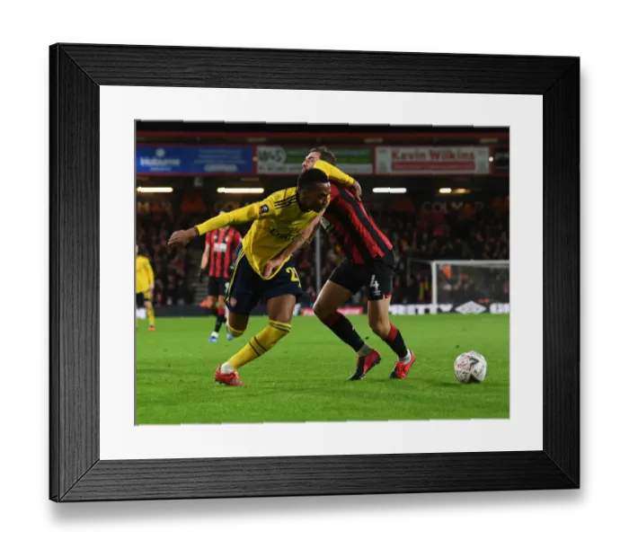 Framed Print : Arsenal's Joe Willock Fights Off Dan Gosling in Intense FA Cup Clash Framed Print : Arsenal's Joe Willock Fights Off Dan Gosling in Intense FA Cup Clash