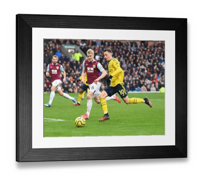Framed Print : Mesut Ozil vs. Ben Mee: Battle at Turf Moor - Arsenal vs. Burnley, Premier League 2019-2020