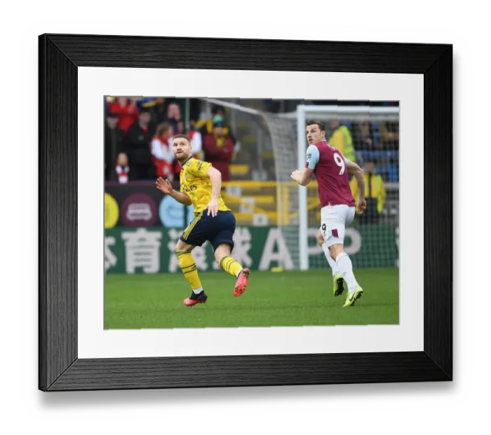 Framed Print : Mustafi vs. Wood: Intense Clash Between Burnley and Arsenal in Premier League