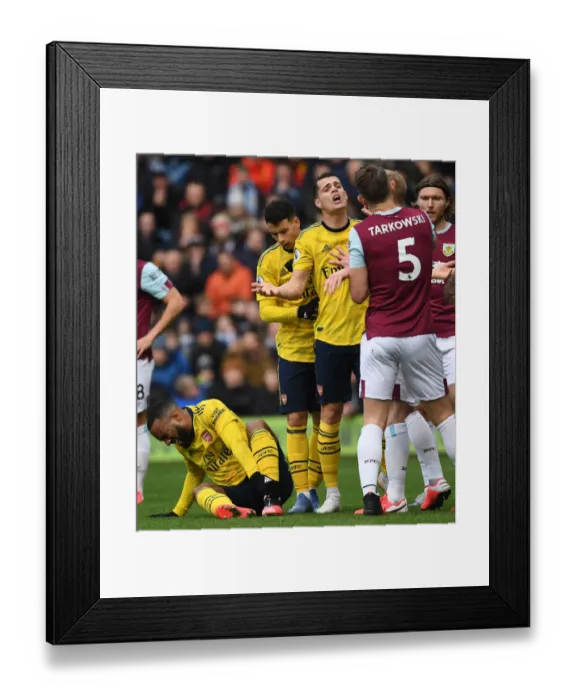 Framed Print : Burnley vs Arsenal: Xhaka and Tarkowski Clash in Intense Premier League Showdown