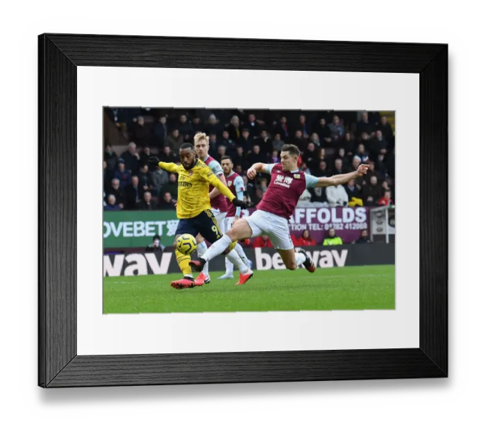 Framed Print : Burnley vs Arsenal: Lacazette vs Tarkowski Clash in Premier League Showdown