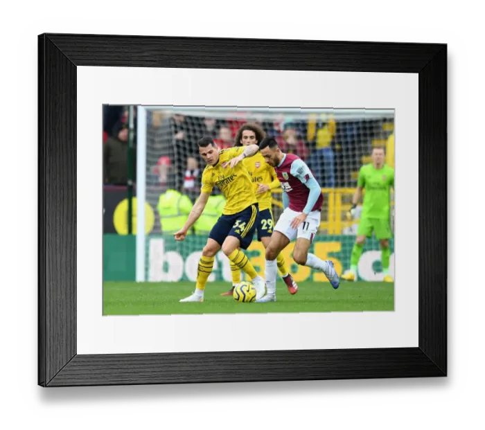 Framed Print : Clash at Turf Moor: Xhaka vs McNeill in Burnley vs Arsenal Premier League Showdown Framed Print : Clash at Turf Moor: Xhaka vs McNeill in Burnley vs Arsenal Premier League Showdown