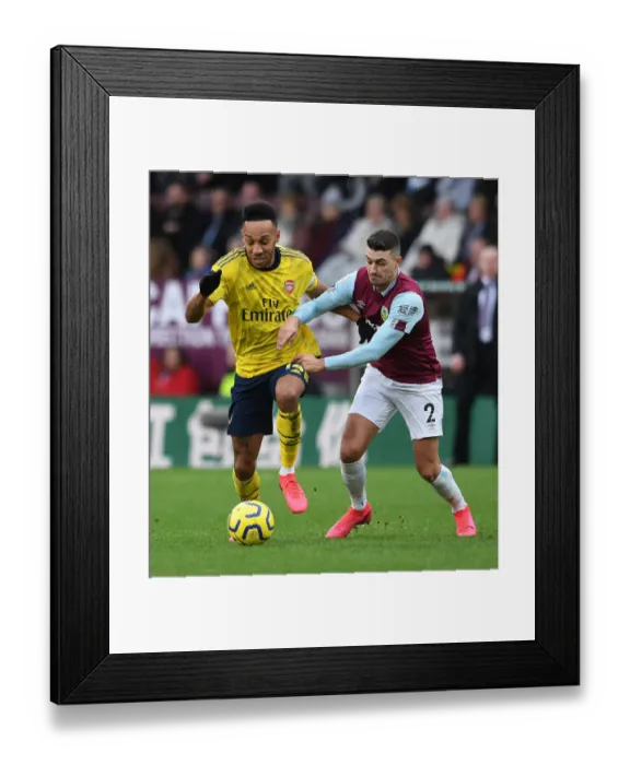 Framed Print : Arsenal's Aubameyang Faces Off Against Burnley's Lowton in Premier League Clash Framed Print : Arsenal's Aubameyang Faces Off Against Burnley's Lowton in Premier League Clash