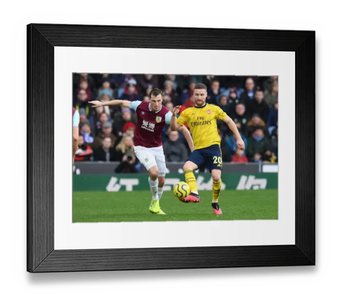 Framed Print : Maitland-Niles vs. Wood: Intense Battle as Arsenal Face Burnley in Premier League Framed Print : Maitland-Niles vs. Wood: Intense Battle as Arsenal Face Burnley in Premier League