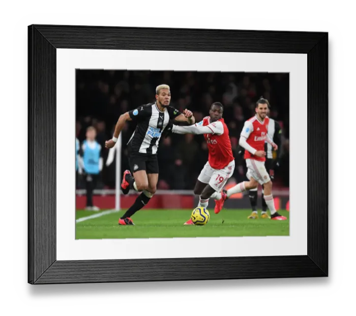 Framed Print : Arsenal vs Newcastle United: Premier League Showdown at Emirates Stadium