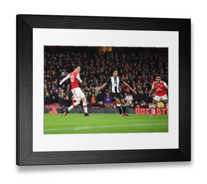 Framed Print : Mesut Ozil Scores the Decisive Goal: Arsenal's Triumph over Newcastle United, Premier League 2019-20 Framed Print : Mesut Ozil Scores the Decisive Goal: Arsenal's Triumph over Newcastle United, Premier League 2019-20