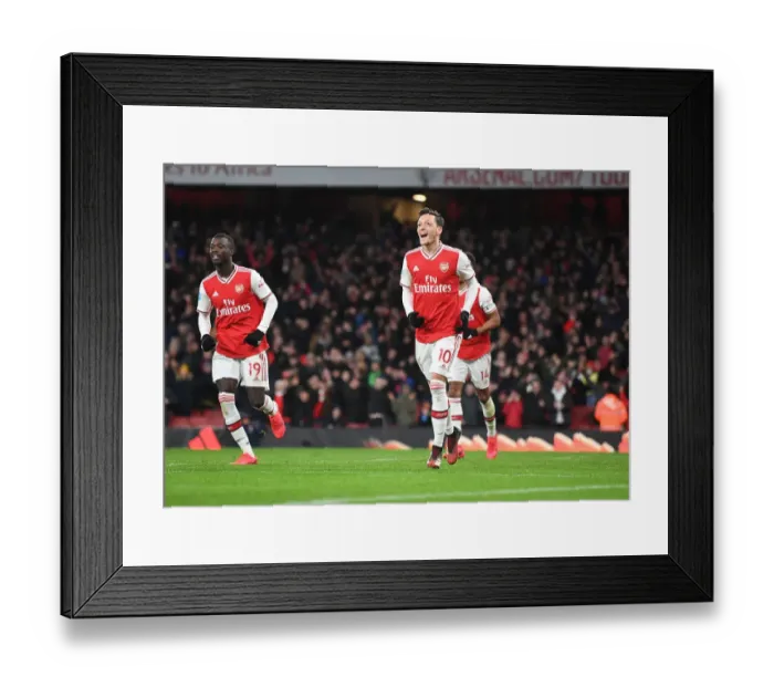 Framed Print : Arsenal's Ozil Scores Third Goal in Exciting Victory over Newcastle United