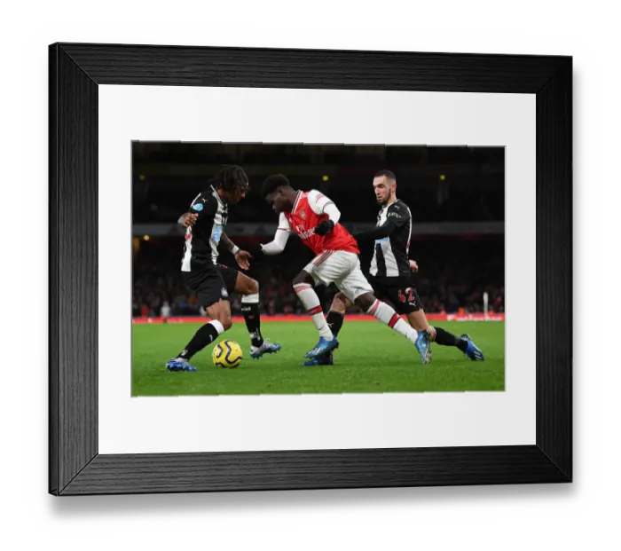 Framed Print : Arsenal vs Newcastle United: Premier League Showdown at Emirates Stadium