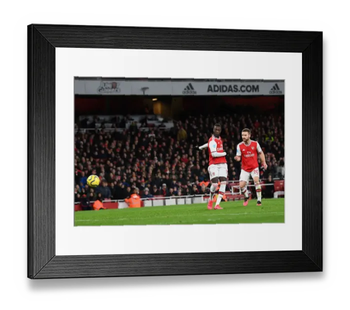 Framed Print : Arsenal's Nicolas Pepe Scores Second Goal Against Newcastle United in Premier League Match Framed Print : Arsenal's Nicolas Pepe Scores Second Goal Against Newcastle United in Premier League Match