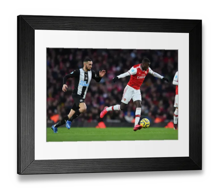 Framed Print : Arsenal vs Newcastle United: Pepe vs Bentaleb Clash in Premier League Showdown Framed Print : Arsenal vs Newcastle United: Pepe vs Bentaleb Clash in Premier League Showdown