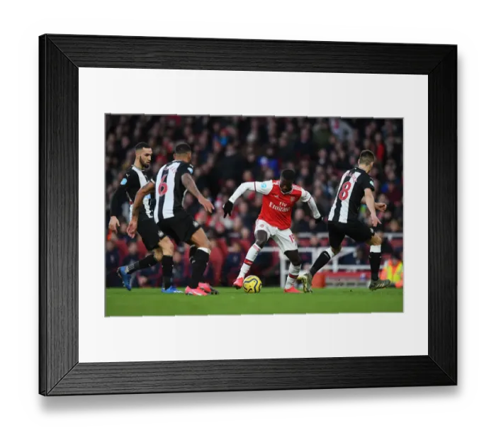 Framed Print : Arsenal's Nicolas Pepe Shines in Arsenal FC vs Newcastle United (2019-20) Framed Print : Arsenal's Nicolas Pepe Shines in Arsenal FC vs Newcastle United (2019-20)