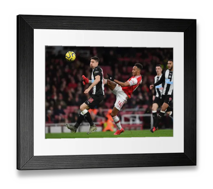 Framed Print : Arsenal vs Newcastle: Aubameyang Faces Off Against Fernandez in Premier League Clash