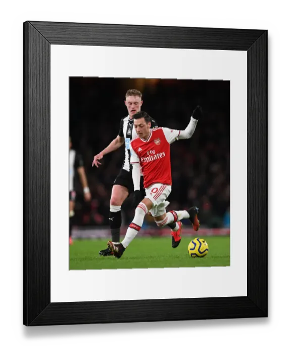 Framed Print : Intense Rivalry: Ozil vs. Longstaff Clash in Arsenal vs. Newcastle Premier League Showdown Framed Print : Intense Rivalry: Ozil vs. Longstaff Clash in Arsenal vs. Newcastle Premier League Showdown