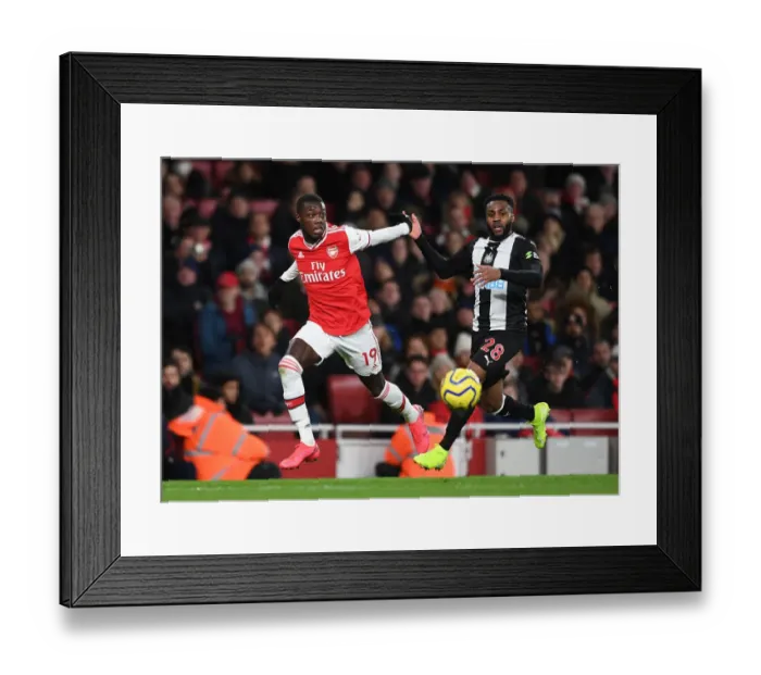 Framed Print : Arsenal's Pepe Clashes with Newcastle's Rose in Premier League Showdown Framed Print : Arsenal's Pepe Clashes with Newcastle's Rose in Premier League Showdown