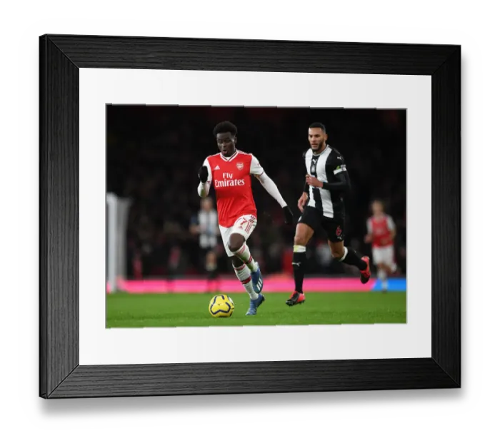 Framed Print : Arsenal's Bukayo Saka in Action against Newcastle United - Premier League 2019-2020