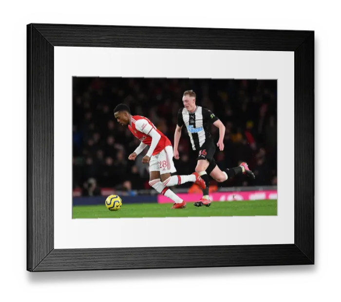Framed Print : Arsenal vs Newcastle United: Joe Willock Clashes with Sean Longstaff in Premier League Showdown
