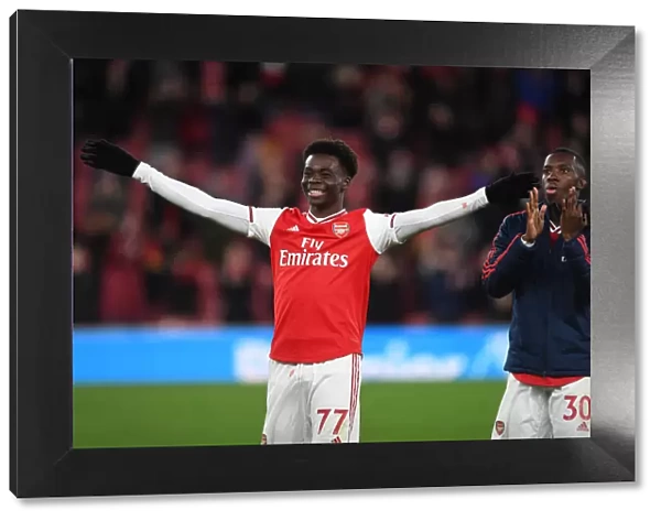 Arsenal's Saka and Nketiah Celebrate Victory Over Newcastle United