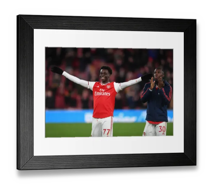 Framed Print : Arsenal's Saka and Nketiah Celebrate Victory Over Newcastle United Framed Print : Arsenal's Saka and Nketiah Celebrate Victory Over Newcastle United