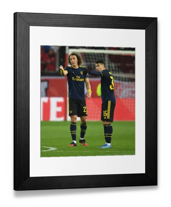 Framed Print : Arsenal vs. Olympiacos: UEFA Europa League Round of 32, First Leg (2020) - Arsenal Player in Action at Karaiskakis Stadium