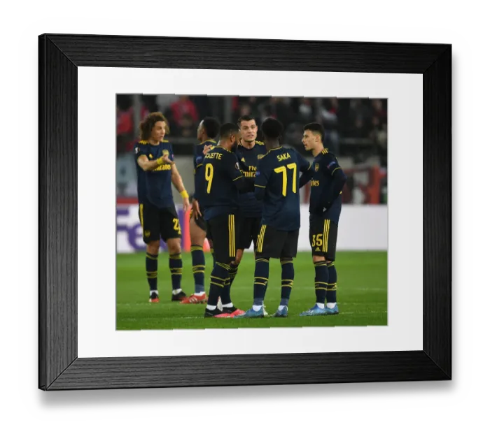Framed Print : Arsenal Takes on Olympiacos in UEFA Europa League Round of 32, First Leg
