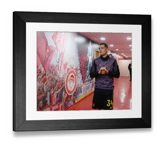 Framed Print : Arsenal vs. Olympiacos: UEFA Europa League First Leg (2020) - Arsenal Player in Action Framed Print : Arsenal vs. Olympiacos: UEFA Europa League First Leg (2020) - Arsenal Player in Action