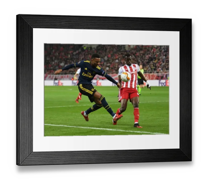 Framed Print : Arsenal's Joe Willock Faces Off Against Olympiacos Ousseynou Ba in Europa League Clash Framed Print : Arsenal's Joe Willock Faces Off Against Olympiacos Ousseynou Ba in Europa League Clash