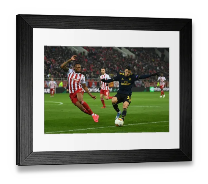 Framed Print : Olympiacos vs Arsenal: Martinelli Faces Off Against Semedo in Europa League Clash