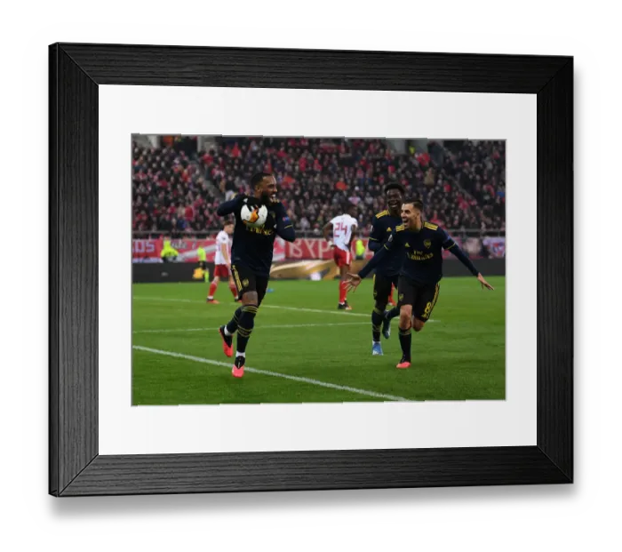 Framed Print : Arsenal's Triumphant Goal Celebration: Lacazette, Ceballos, and Saka's Unity in UEFA Europa League