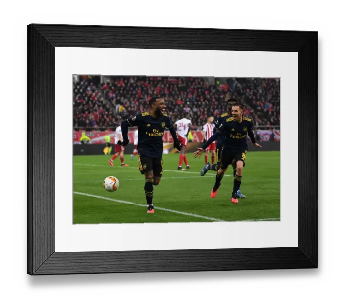 Framed Print : Alexandre Lacazette's Goal: Arsenal's Victory Over Olympiacos in Europa League Round of 32 (First Leg)