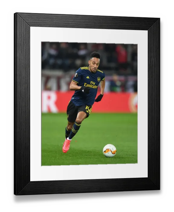 Framed Print : Arsenal's Aubameyang Goes Head-to-Head with Olympiacos in Europa League Showdown