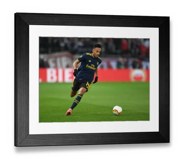 Framed Print : Arsenal's Aubameyang Goes Head-to-Head with Olympiacos in Europa League Showdown