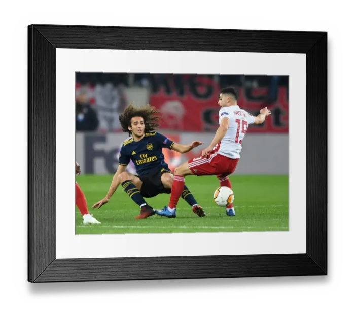 Framed Print : Arsenal's Guendouzi Faces Off Against Olympiacos Masouras in Europa League Clash Framed Print : Arsenal's Guendouzi Faces Off Against Olympiacos Masouras in Europa League Clash